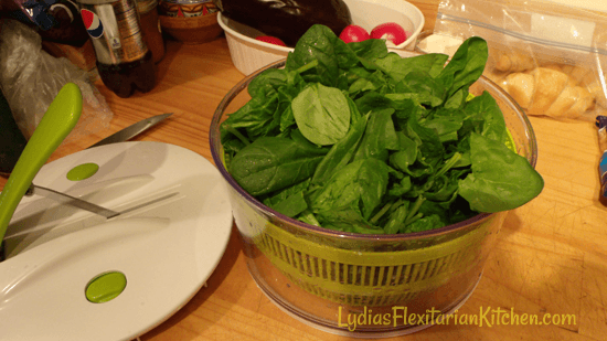 salad spinner full of spinach