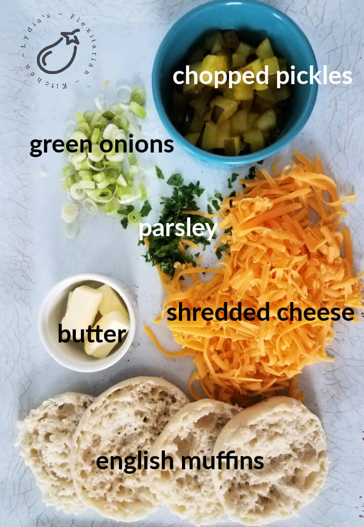 large photo with ingredients for cheesy toasts with pickle
