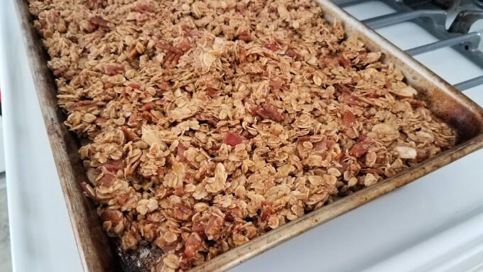 photo of bacon granola as it comes from the oven on a tray