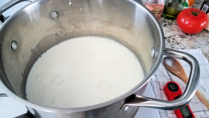 heating the milk and buttermilk to make homemade ricotta