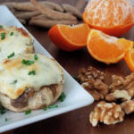 Photo of cheesy mushrooms with herbs plus oranges, walnuts and crackers