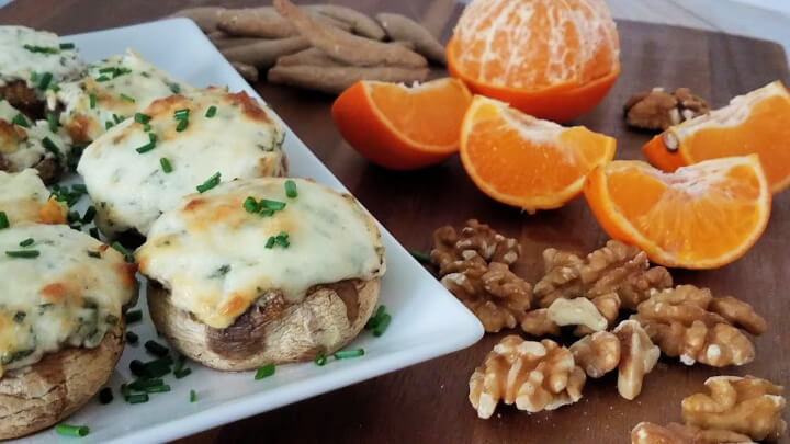 Photo of cheesy mushrooms with herbs plus oranges, walnuts and crackers
