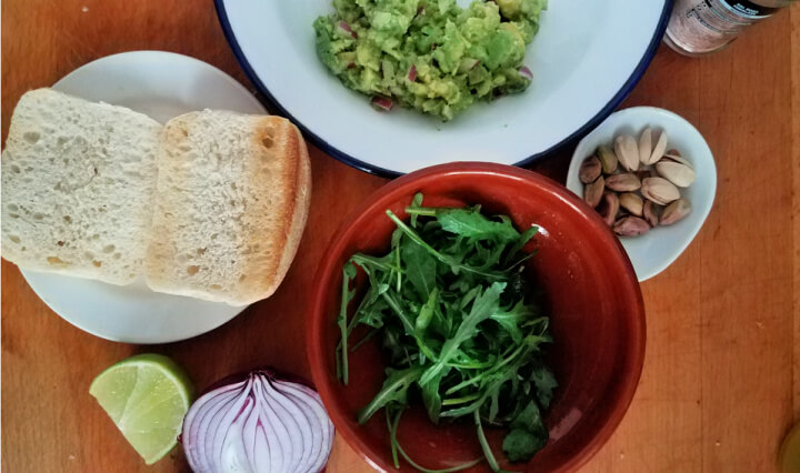 ingredients for avocado, arugula and pistachio sandwich