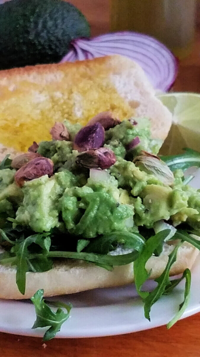 close up view of an avocado sandwich
