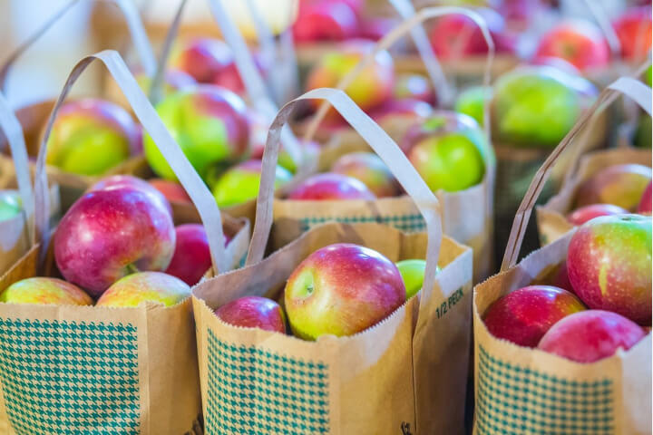 photo of apples in paper bags
