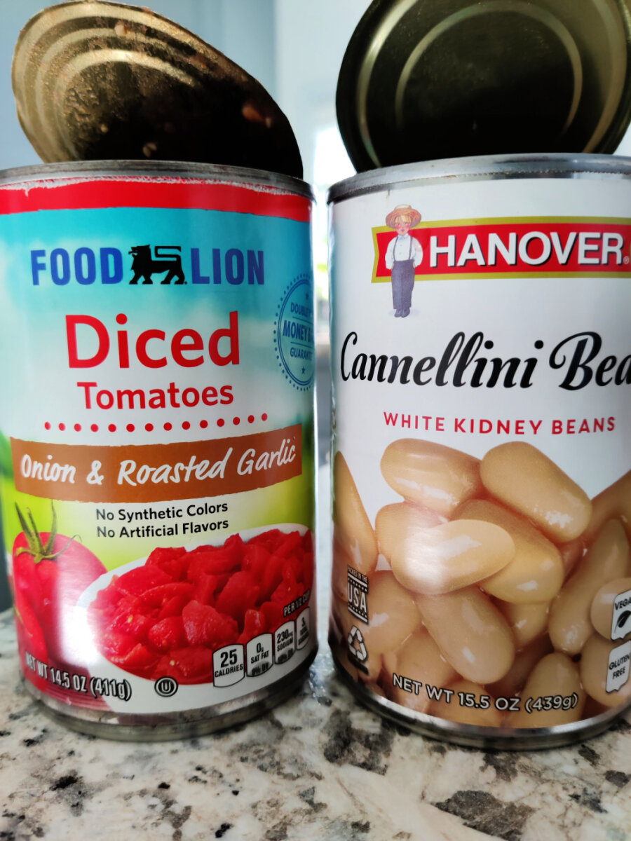 empty cans of beans and tomatoes